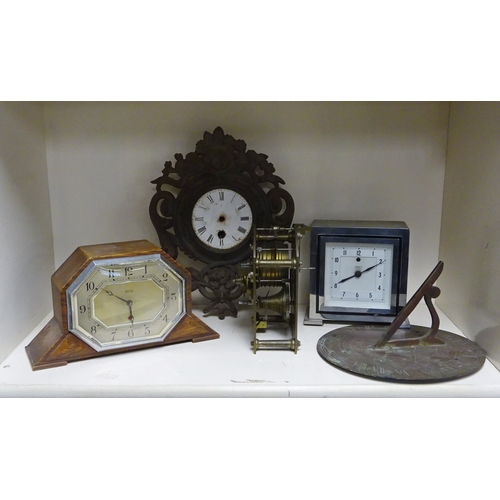 208 - A Temco electric mantel clock in a chromed case; a Smiths electric mantel clock in an oak case; a pa... 