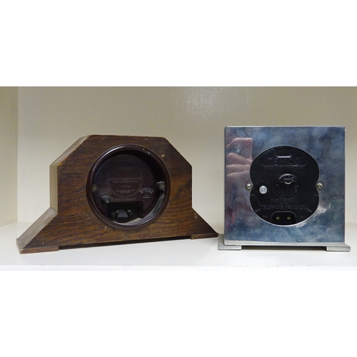 208 - A Temco electric mantel clock in a chromed case; a Smiths electric mantel clock in an oak case; a pa... 