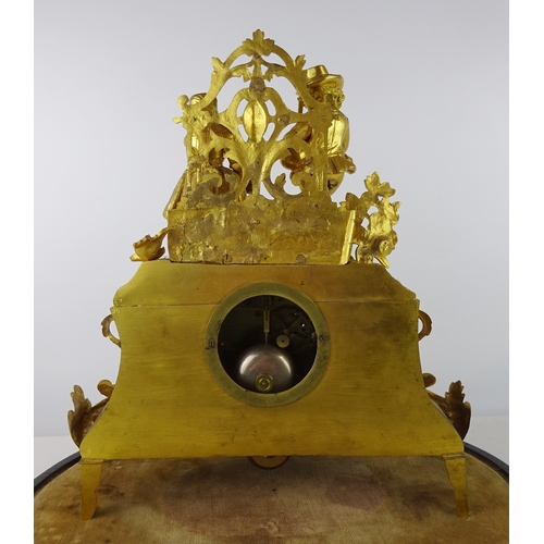 3 - A continental mantel clock in a gilt base metal figural case, approximately 35cm tall presented on a... 