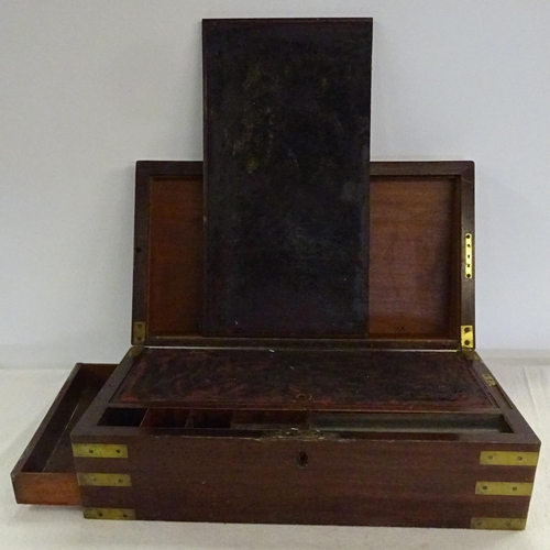106 - A Victorian mahogany brass bound writing box. 50cm wide