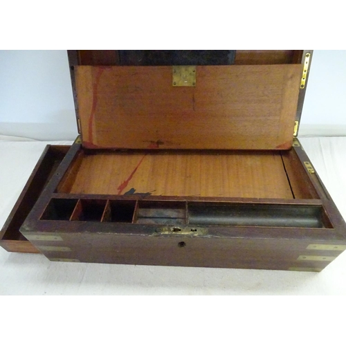 106 - A Victorian mahogany brass bound writing box. 50cm wide