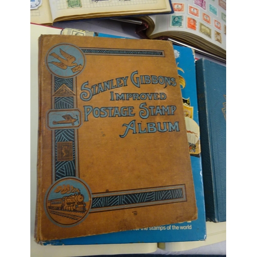 120 - A collection of ten stamp albums.