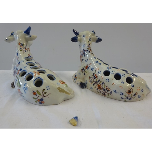 7 - Two Quimper Faience cow vase's 9cm tall 18cm wide af one missing horn, one loose horn, together with... 