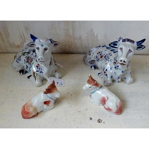 7 - Two Quimper Faience cow vase's 9cm tall 18cm wide af one missing horn, one loose horn, together with... 