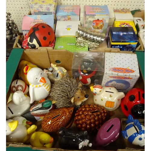 87 - A large quantity of various money boxes to include Royal Doulton Store Stump Money Box, Villeroy & B... 