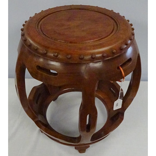 105 - A hardwood Oriental barrel stool 45cm tall.