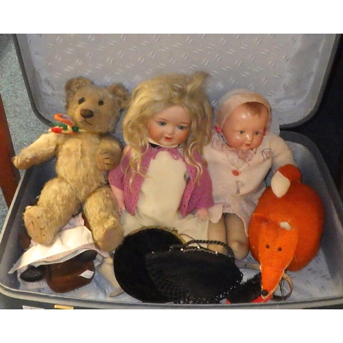 184 - A porcelain A.M Koppelsdorf German doll together with further teddys, and dolls and two purses.