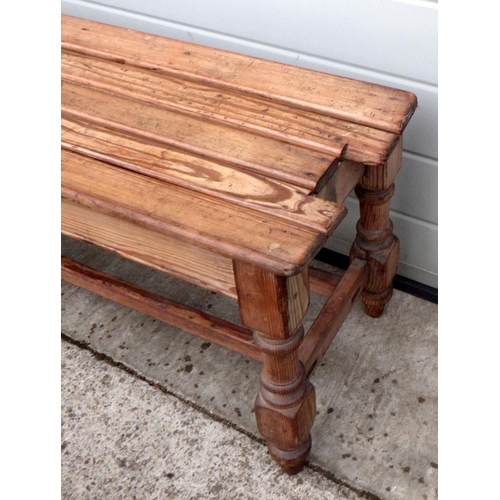 604 - A Victorian pine long railway platform bench, missing back rest 152cm long