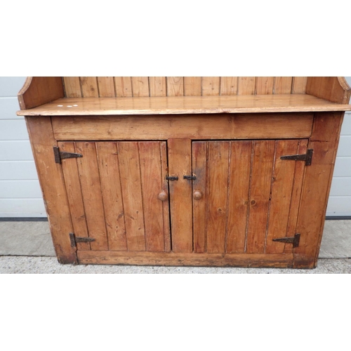 605 - A Pine cupboard dresser 138cm wide x 189cm high