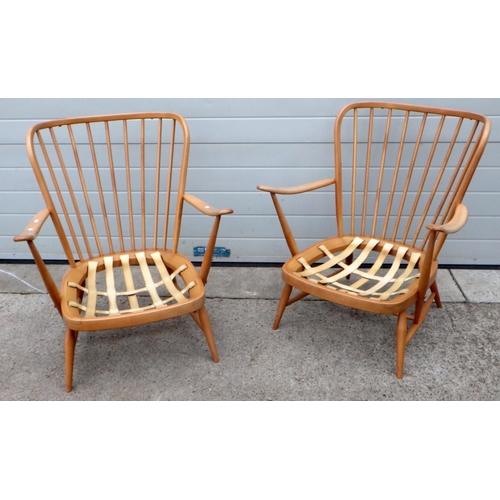 638 - A pair of blonde Ercol easy chair frames