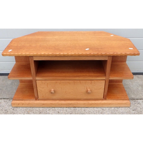 644 - An oakleaf motif light oak television stand, 92cm wide