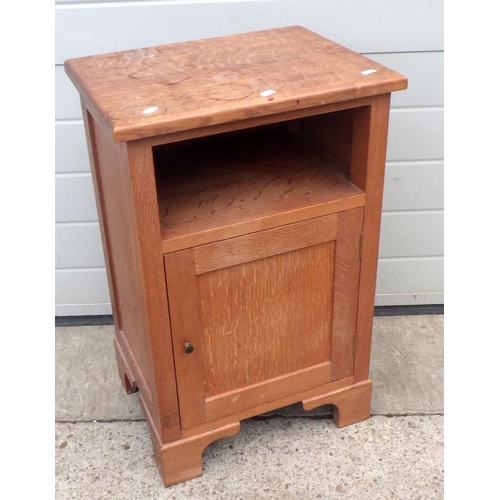 646 - An oak bedside cabinet with squirrel motif, 46cm wide