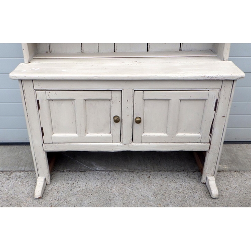 649 - A later painted pine dresser with fixed back and panelled doors, 133cm wide