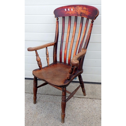 664 - A Victorian kitchen armchair, stamped W.B.G