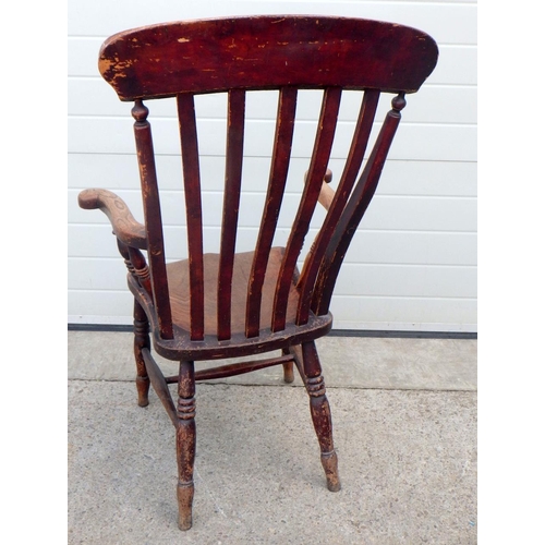 664 - A Victorian kitchen armchair, stamped W.B.G