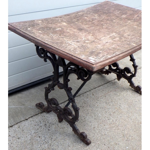 665 - A rectangular garden table with cast iron base, top a/f, 106cm long