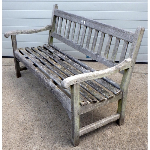 667 - A teak garden bench, a/f loose, 148cm wide (Made from teak from the HMS Powerful).