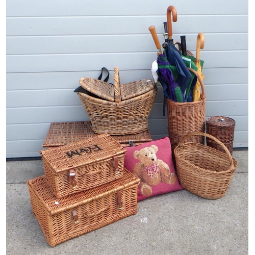 676 - A wicker stick stand with sticks and umbrellas, further baskets and hampers incl Fortnum & Mason  et... 