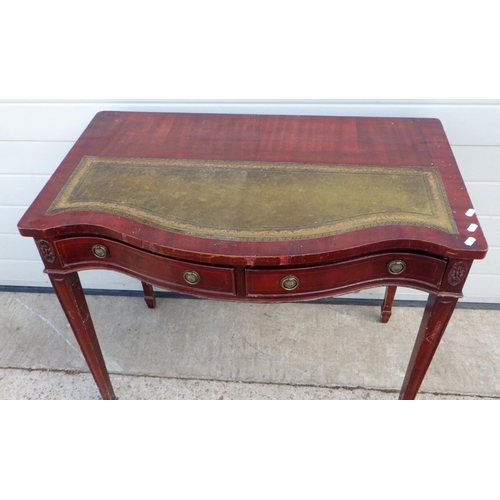 683 - A reproduction leather topped lady's writing table, missing superstructure together with a modern gl... 