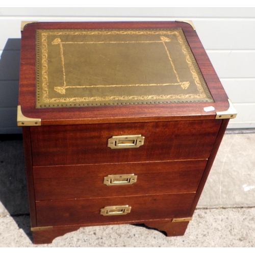 708 - A small reproduction Military style chest of drawers with leather inset top, brass bound corners and... 