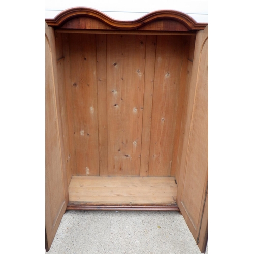 729 - A Continental walnut double arched wardrobe, a/f worm, 129cm wide