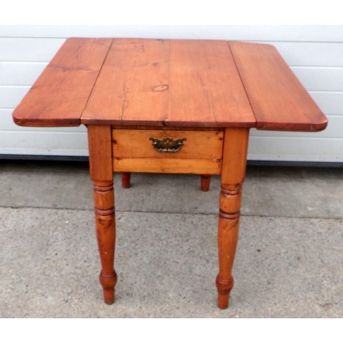 755 - A Victorian pine drop leaf table on turned legs, 96cm long