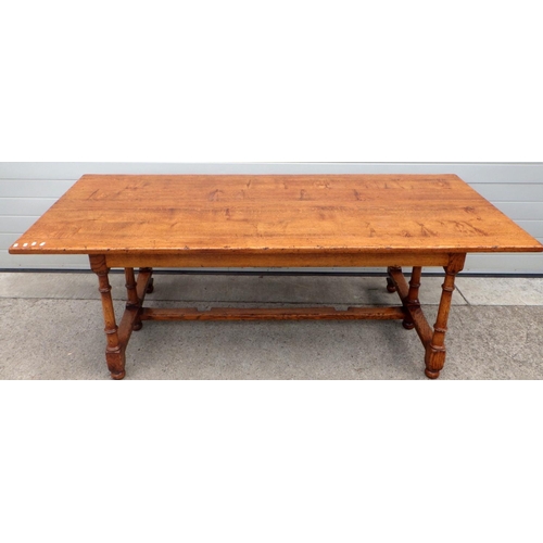 776 - A solid oak drop leaf refectory table 213cm (7ft) long x 91cm (3ft) wide, hinged along its long axis... 