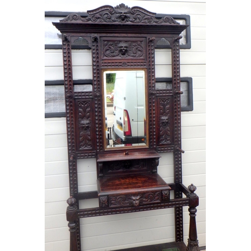 794 - A Victorian mask carved oak hallstand, 119cm wide