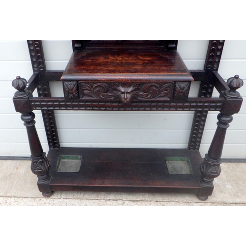 794 - A Victorian mask carved oak hallstand, 119cm wide