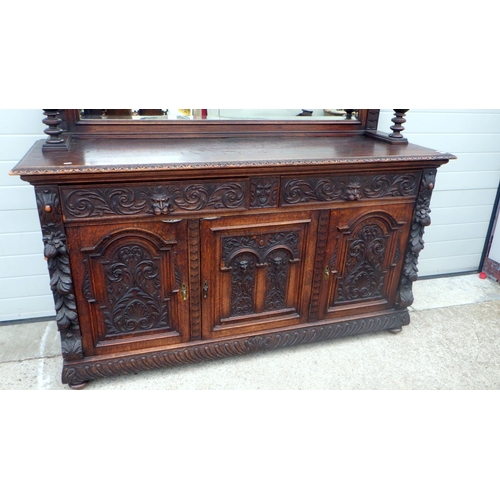 795 - A Victorian mask carved oak mirrorback sideboard, top moulding a/f, 185cm wide