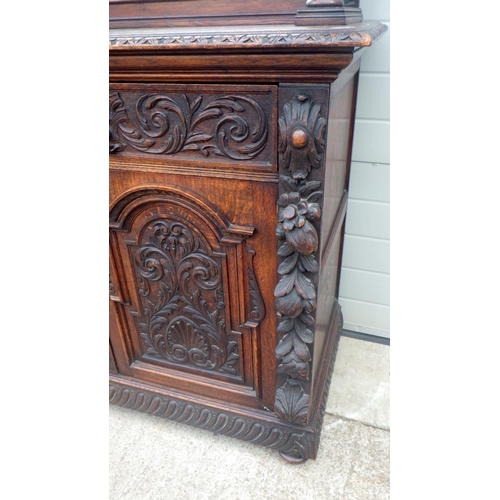 795 - A Victorian mask carved oak mirrorback sideboard, top moulding a/f, 185cm wide