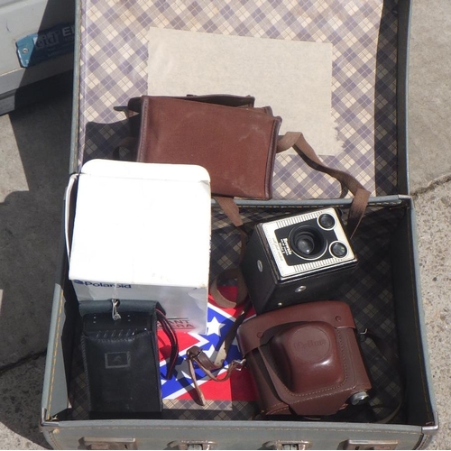 835 - Two cased sewing machines, a grey suitcase & cameras