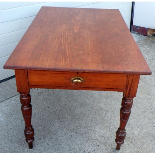 838 - A late Victorian pitch pine office table with drawer to either end on turned legs. 137cm long.