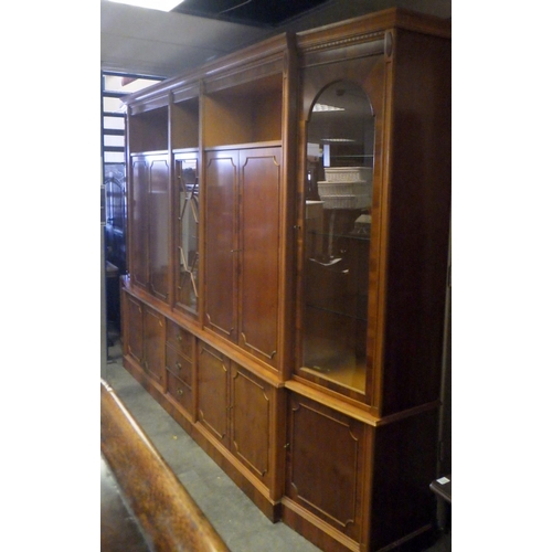 860 - A large reproduction yew side cabinet (approx. 360cm long)