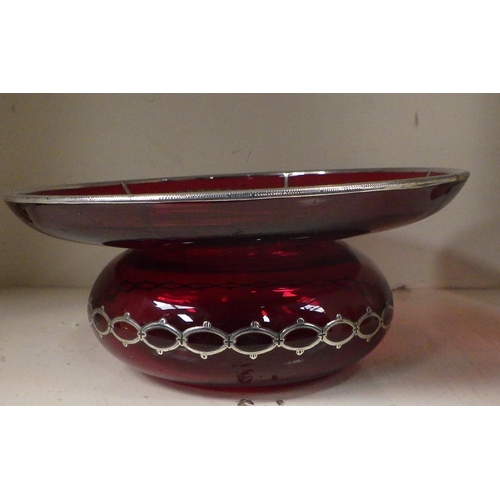 241 - A red glass squat vase having silvered applied decoration