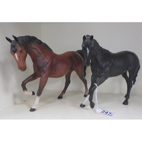 247 - Two Beswick horses together with two Beatrix Potter musical figures (Repair to cats ear) (4).