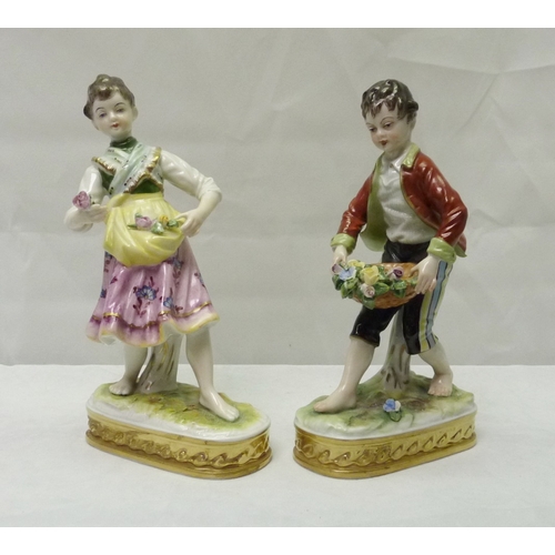 319 - A pair of Sitzendorf porcelain figures 6.5 ins, depicting boy and girl flower sellers af.