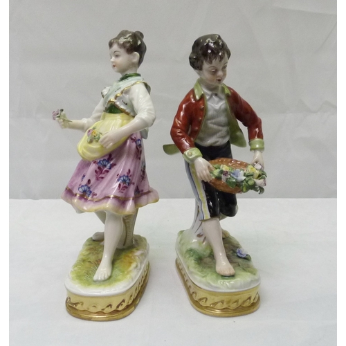 319 - A pair of Sitzendorf porcelain figures 6.5 ins, depicting boy and girl flower sellers af.