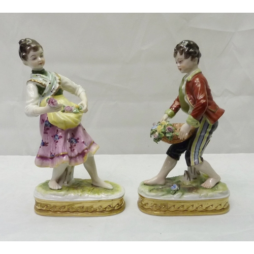 319 - A pair of Sitzendorf porcelain figures 6.5 ins, depicting boy and girl flower sellers af.