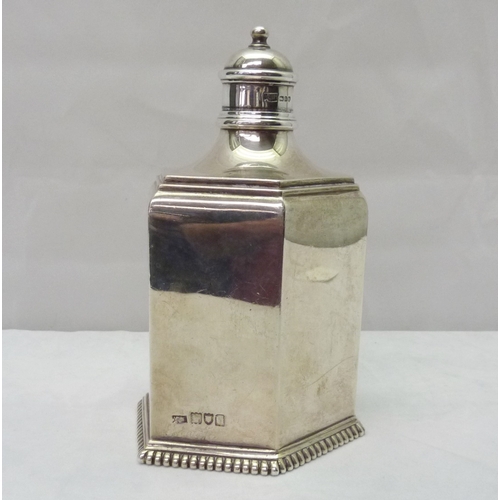 417 - A silver hexagonal bottle-shaped caddy, Mappin & Webb, London, 1915.  145mm tall / 320gr