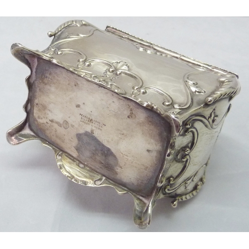 418 - A silver tea caddy of bombe form having Rococo influence decoration, Chester 1907, sponsors mark rub... 