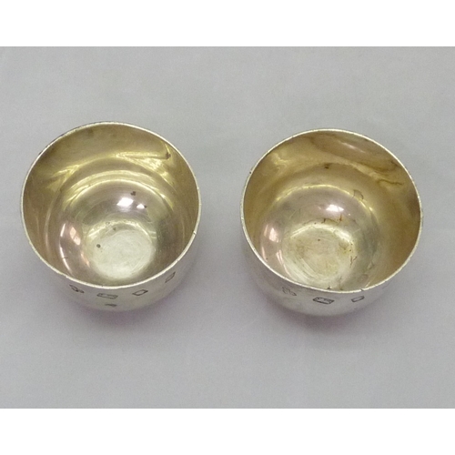 420 - A pair of silver tumbler cups, Payne & Son, London 1965.  A/F bruises & slight distortion.  Each 55m... 