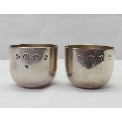 420 - A pair of silver tumbler cups, Payne & Son, London 1965.  A/F bruises & slight distortion.  Each 55m... 