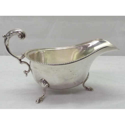 425 - Two silver sauce boats, both standing on hoof feet, early 20th cent.  Larger sauce boat 180mm long /... 