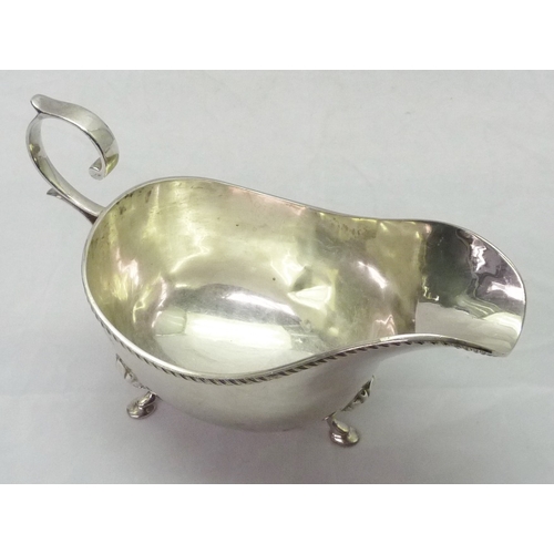 425 - Two silver sauce boats, both standing on hoof feet, early 20th cent.  Larger sauce boat 180mm long /... 