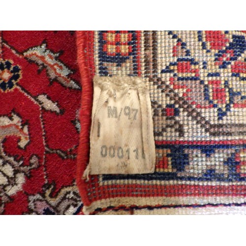 883 - A red ground rug 140 x 99cm