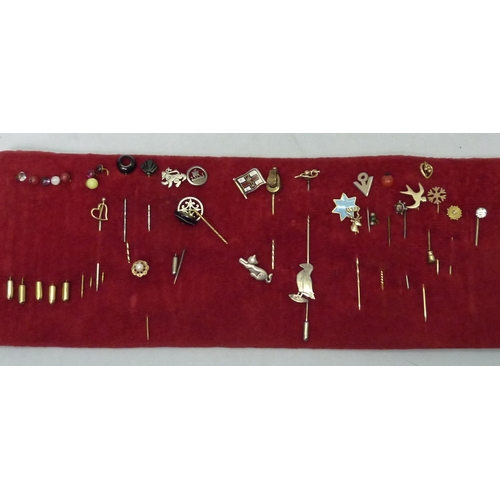 384 - A collection of stick pins, costume jewellery, and wrist watches.