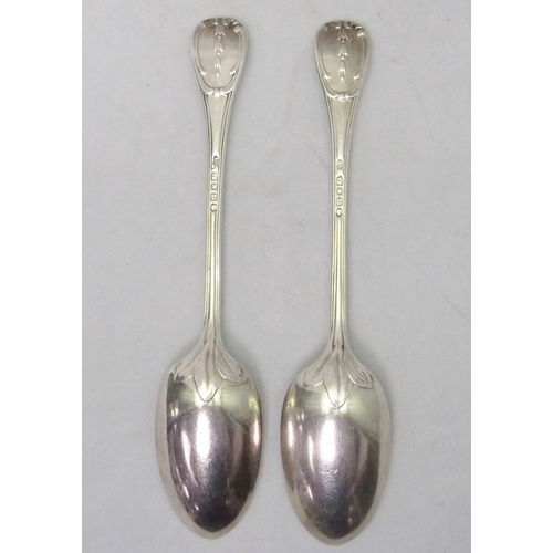 401 - A pair of Victorian silver table spoons of reeded acanthus leaf scroll design with each engraved wit... 