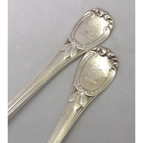 401 - A pair of Victorian silver table spoons of reeded acanthus leaf scroll design with each engraved wit... 