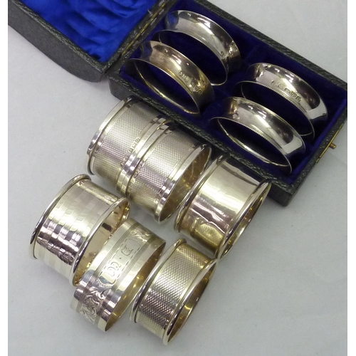 404 - Ten various silver napkin rings incl a cased part set of four.  100gr total